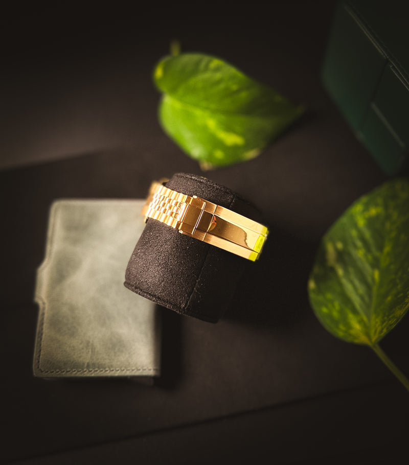 Close-up of the brushed stainless steel golden color folding clasp on the Valenne left-handed automatic watch.
